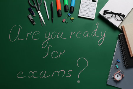 Green chalkboard with phrase Are You Ready For Exams and different stationery, flat layの写真素材