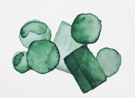 Green watercolor circles and rectangles on white background, top viewの写真素材