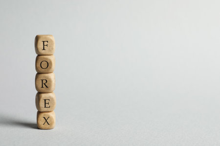 Word Forex made of wooden cubes with letters on light gray background. Space for textの写真素材