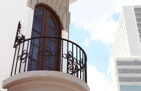 Exterior of building with beautiful window and balcony, low angle viewの写真素材
