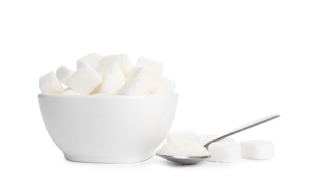 Ceramic bowl and spoon with refined sugar cubes on white backgroundの写真素材