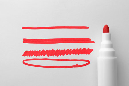 Different stripes and ellipse drawn with red marker isolated on white, top viewの写真素材