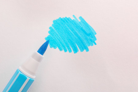 Stroke drawn with light blue marker and highlighter isolated on white, top viewの写真素材