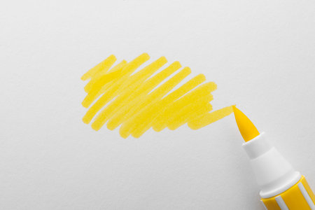 Stroke drawn with yellow marker and highlighter isolated on white, top viewの写真素材