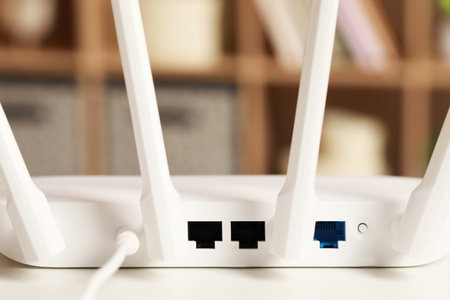 New WiFi router on white table indoors, back view