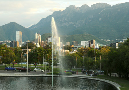 View of beautiful fountain in park near mountainの写真素材