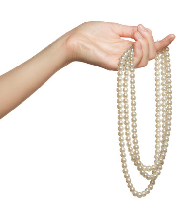 Woman holding elegant pearl necklace on white background, closeupの写真素材