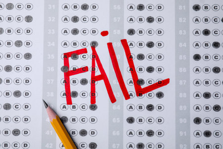 Word Fail written with red marker on answer sheet, flat lay. student passing examの写真素材