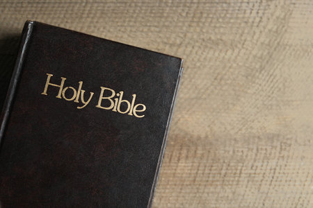 Holy Bible on wooden table, top view. Space for textの写真素材