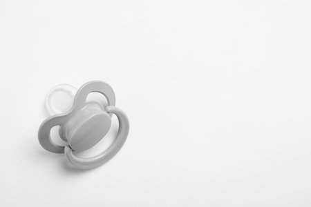 Baby pacifier on white background, space for textの写真素材