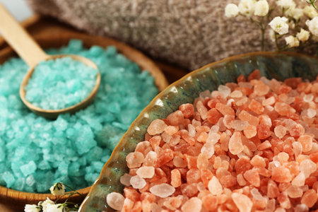 Aromatic sea salt and beautiful flowers, closeupの写真素材