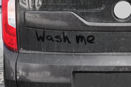 Inscription WASH ME on dirty car, closeupの写真素材