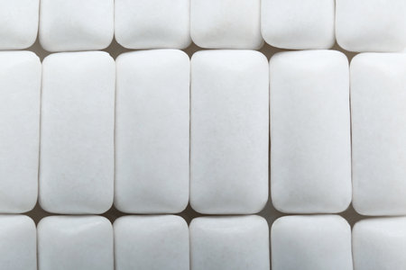 Tasty white chewing gums as background, top viewの写真素材