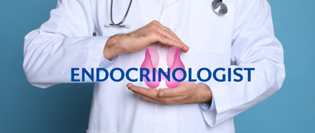 Endocrinologist holding thyroid illustration on light blue background, closeup. banner designの写真素材