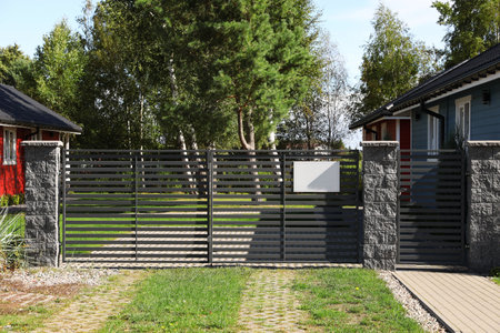 Metal gates near beautiful buildings on sunny day