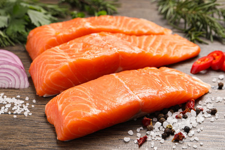 Fresh salmon and ingredients for marinade on wooden table, closeupの写真素材