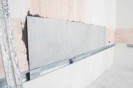 New wall tiles installed in room prepared for renovationの写真素材
