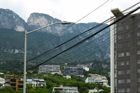 Beautiful view of the city and green mountainsの写真素材
