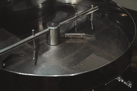 Stainless coffee roaster machine indoors. modern device