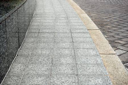 View on empty stone sidewall. Footpath covering