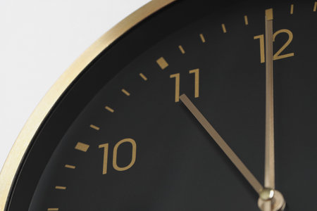 Stylish round clock on white background, closeup. Interior elementの写真素材