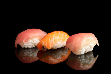 Delicious nigiri sushi on black background. Traditional Japanese foodの写真素材