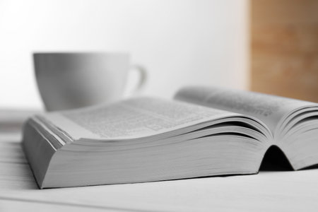 Open Bible on white wooden table indoors, closeup. religious bookの写真素材
