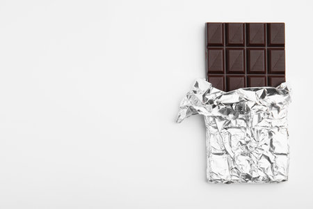 Tasty chocolate bar on white background, top viewの写真素材