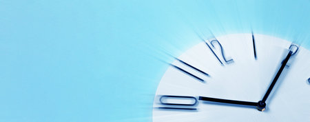 Fleeting time concept. Clock on light blue background, motion effect. Banner design with space for textの写真素材