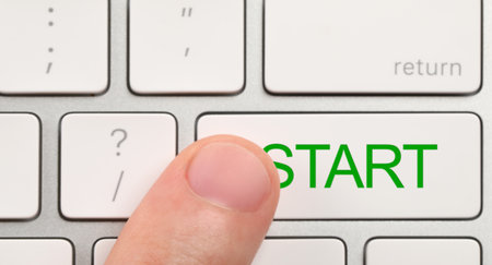 Man pressing button with word Start on computer keyboard, closeup