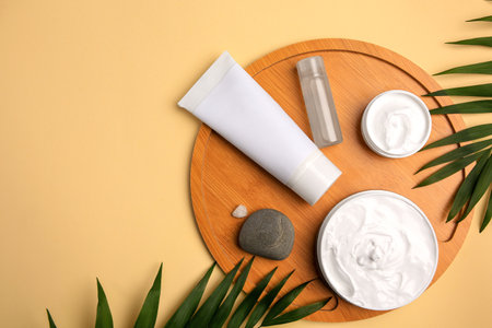 Flat lay composition with different cosmetic products on beige background. Space for textの写真素材
