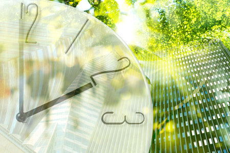 Time related concepts. Multiple exposure of clock, office buildings and trees