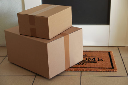 Parcels delivered on mat near front doorの写真素材