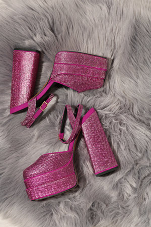 New pink high heeled shoes with platform and square toes on gray fur, flat layの写真素材
