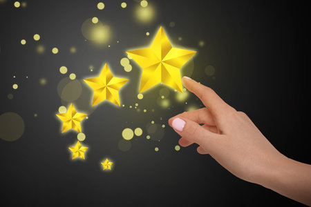 quality rating. Woman pointing at stars on black background, closeup