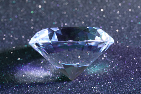 Beautiful dazzling diamond on glitter background, closeupの写真素材