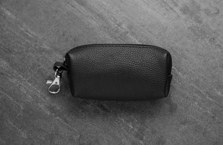Stylish leather keys holder on gray table, top viewの写真素材