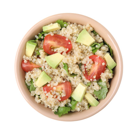 Delicious quinoa salad with tomatoes, avocado and parsley isolated on white, top viewの写真素材