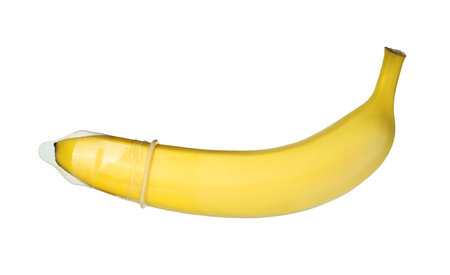 Banana with condom isolated on white. safe sex conceptの写真素材