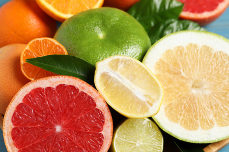 Different citrus fruits with fresh leaves, closeupの写真素材