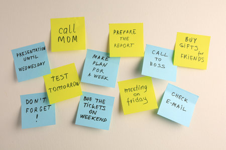 Many different reminder notes on white wall