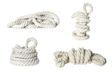Set with bundles of cotton ropes on white backgroundの写真素材