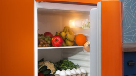 Open refrigerator full of many different productsの写真素材