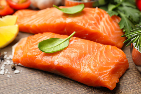 Fresh salmon and ingredients for marinade on wooden table, closeupの写真素材