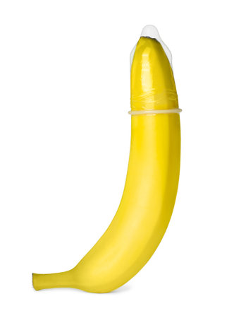 Banana with condom isolated on white. safe sex conceptの写真素材