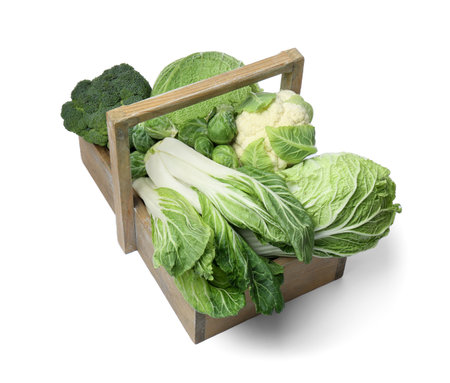 Wooden crate with different types of fresh cabbage on white backgroundの写真素材