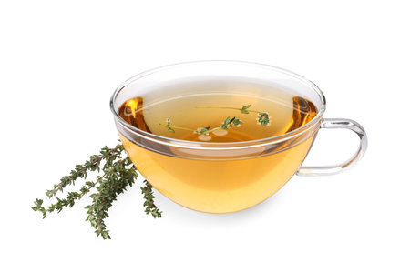 Cup of aromatic herbal tea and fresh thyme isolated on whiteの写真素材