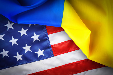 National flags of Ukraine and USA symbolizing partnership between countriesの写真素材