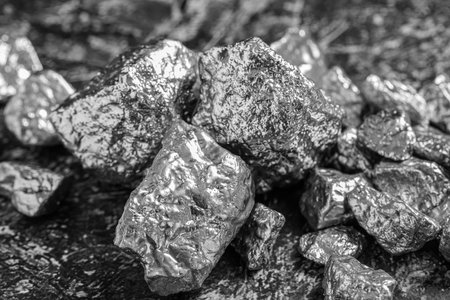 Pile of silver nuggets on gray textured table, closeupの写真素材