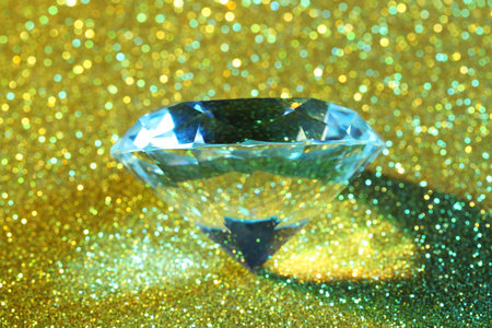 Beautiful dazzling diamond on glitter background, closeupの写真素材